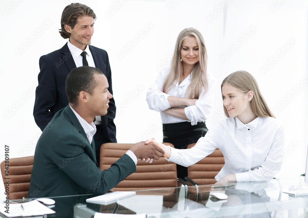 handshake Manager and the client in the office handshake Manager and the client in the office