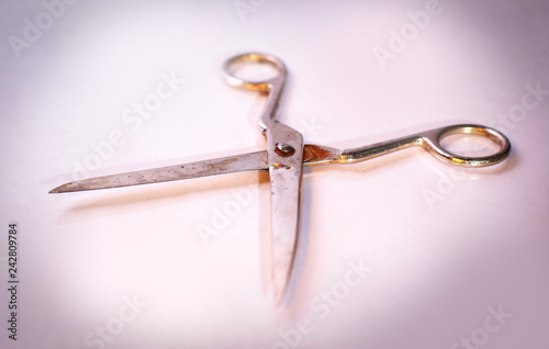 old scissors.isolated on a dark background