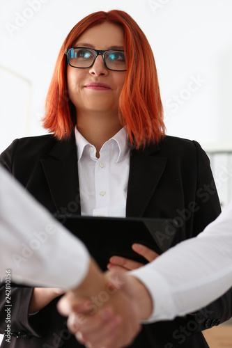 Smiling man in suit shake hands as hello