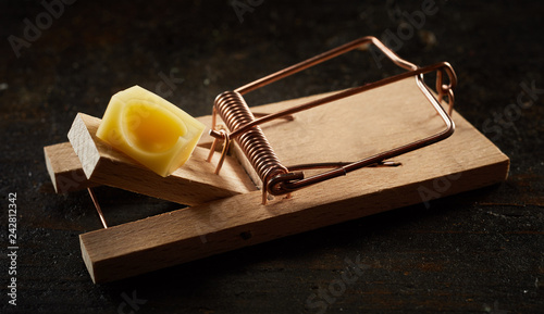 Photos Spring mousetrap with cheese in close-up