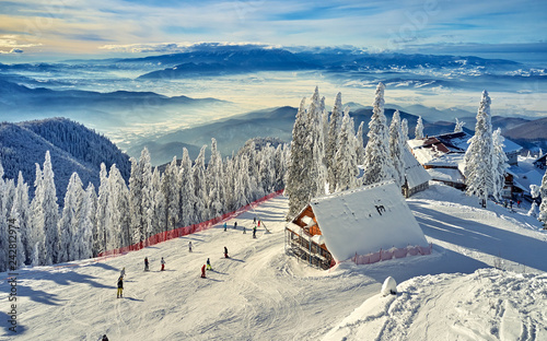 Картината върху платно Wooden chalets and spectacular ski slopes in the Carpathians,Panoramic view over