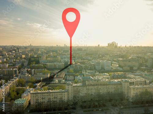 aerial shot of marker pointing on the streets of europe city during sunset b