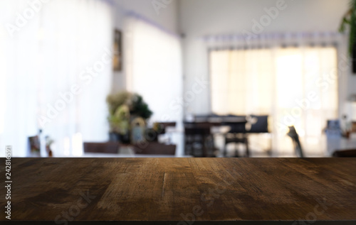 Empty dark wooden table in front of abstract blurred bokeh background of restaurant . can be used for display or montage your products.Mock up for space.