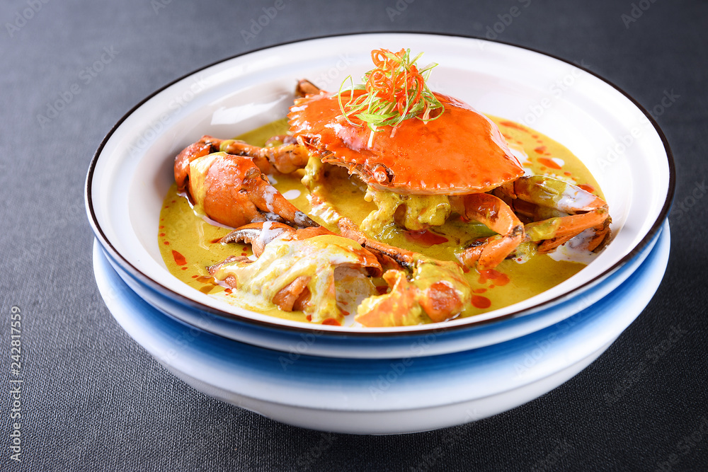 Grilled sea crab with cheese in a white dish Grilled sea crab with cheese in a white dish