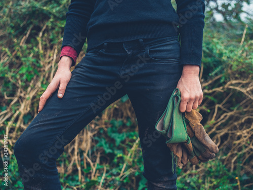 Woman with gardening gloves in the garden