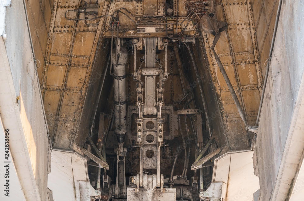 Old Front landing gear and shock absorption of big aircraft, spacecraft - closeup high detailed view. Landing gear is the undercarriage of an aircraft and may be used for either takeoff or landing.