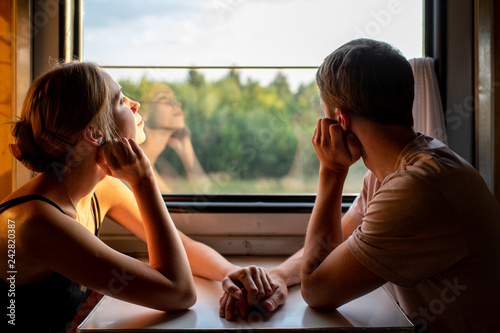Fotografija Couple of lovers traveling in train