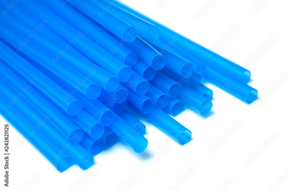 closeup of blue plastic straw collection on white background