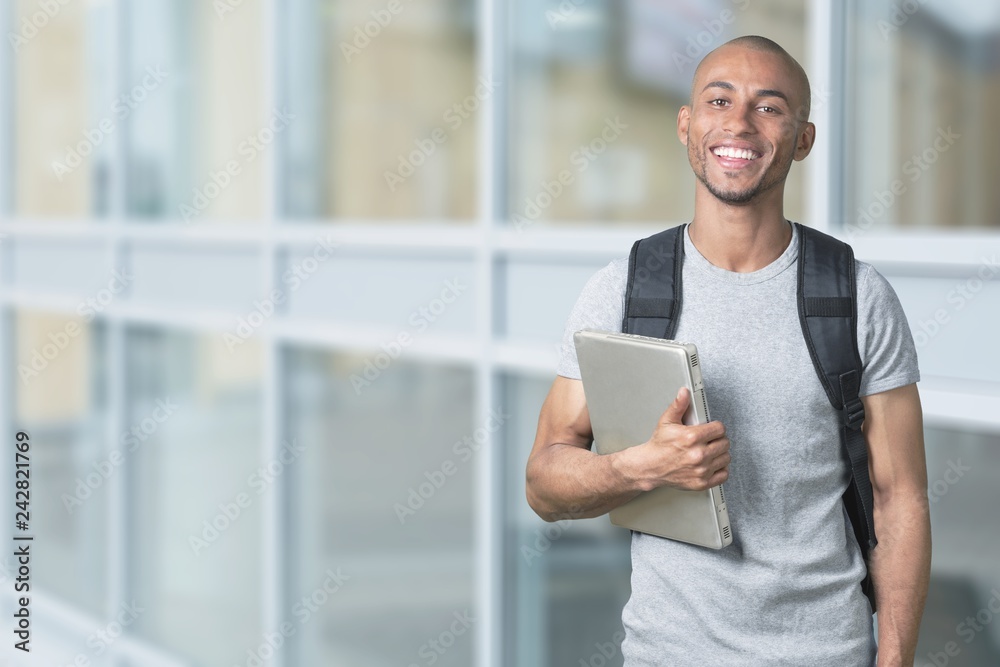 Portrait of smiling young african college student Portrait of smiling young african college student