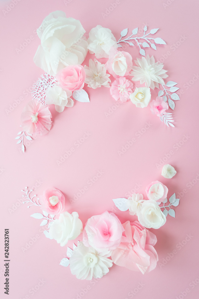 white and pink paper flowers on the pink background white and pink paper flowers on the pink background