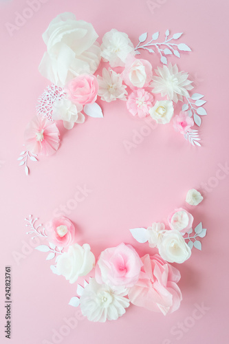 white and pink paper flowers on the pink background