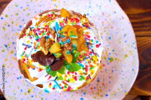 Delicious easter cake with colorful icing on a colorful plate. Top view. Easter concept  flat lay.