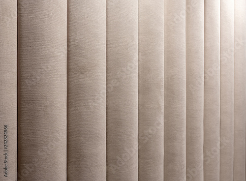 Closeup photo of brown textile wall panel with texture