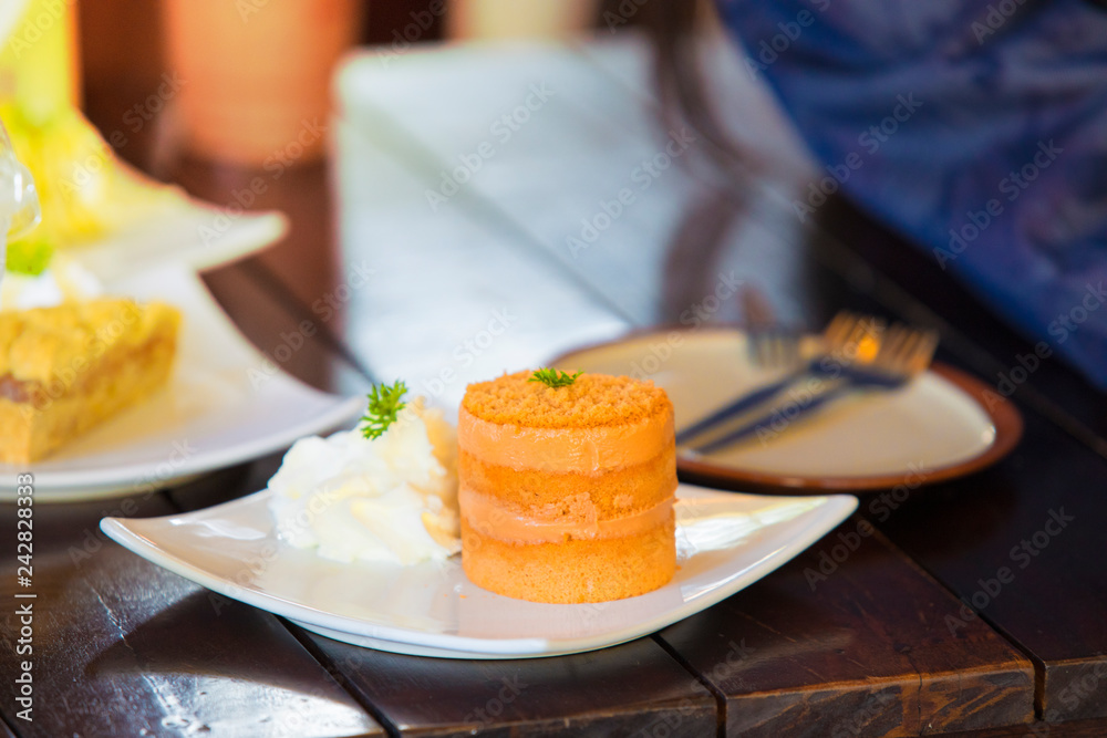 Cake orange, Orange cake on a wooden table,Cake background Cake orange, Orange cake on a wooden table,Cake background