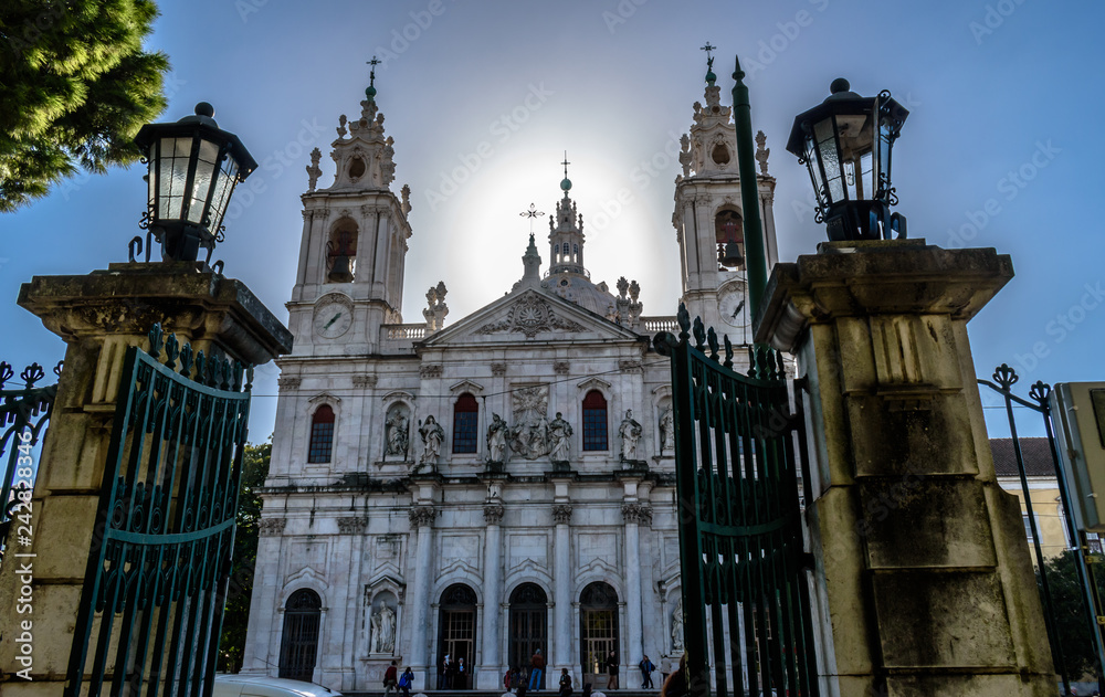 View to the Basilica da Estrela framed by the gates of Jardim da Estrela, Lapa - Portugal