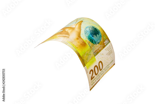 Flying Swiss money - 200 francs note isolated with clipping path photo