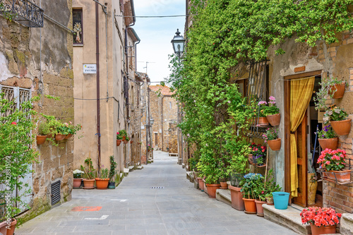 Fototapeta Naklejka Na Ścianę i Meble -  Beautiful alley in Tuscany, Old town, Italy