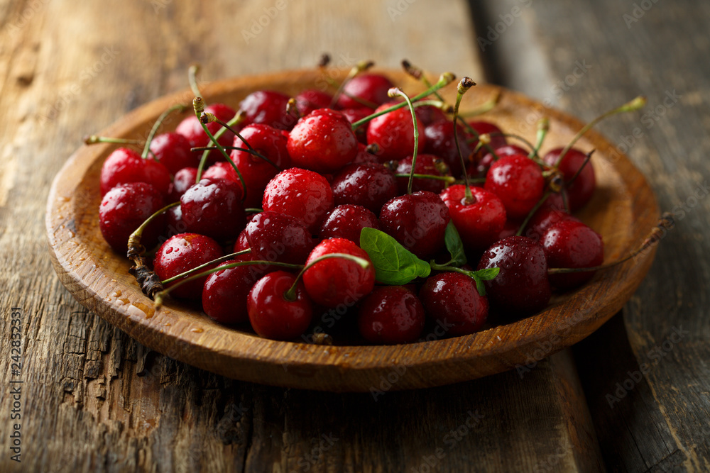 Fresh cherry on wooden desk Fresh cherry on wooden desk