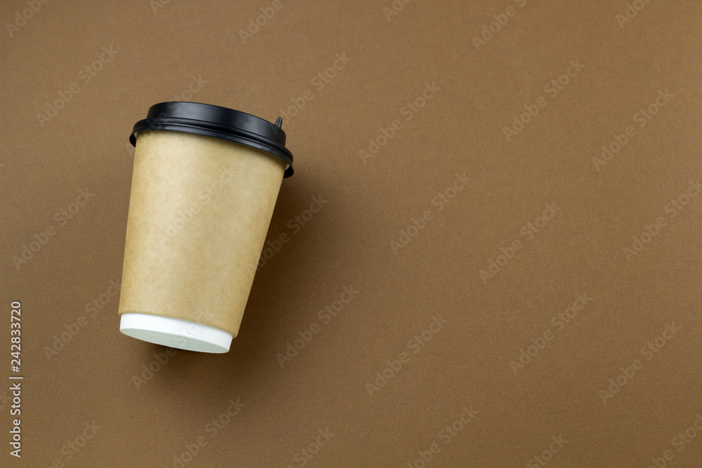 disposable paper cups on a brown background disposable paper cups on a brown background