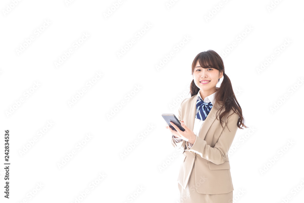 スマートフォンを使う制服姿の学生 スマートフォンを使う制服姿の学生