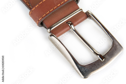 Leather belt with a buckle on a white background