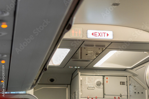 Fire exit sign on airplane, Selective focus.