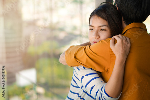 Young depressed asian woman hug her friend for encouragement, Selective focus, PTSD Mental health concept.
