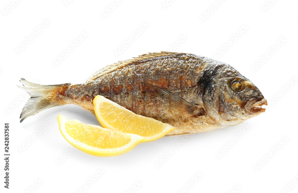 Grilled dorado fish with lemon on white background