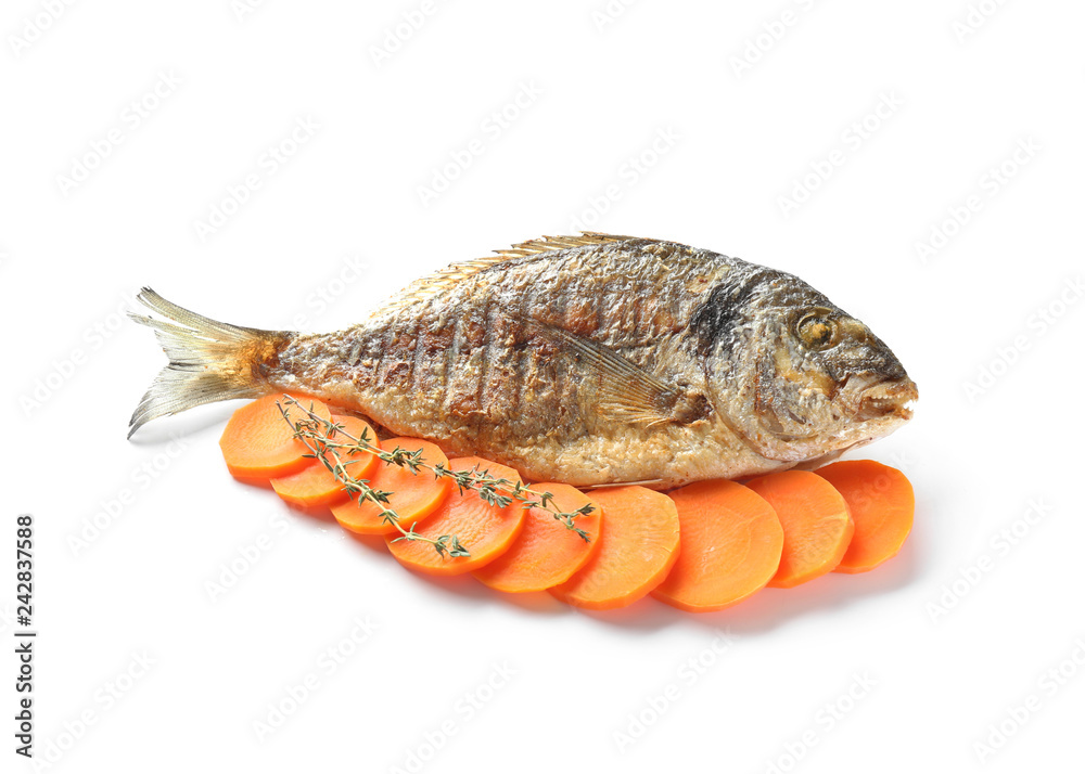 Grilled dorado fish with carrot on white background Grilled dorado fish with carrot on white background