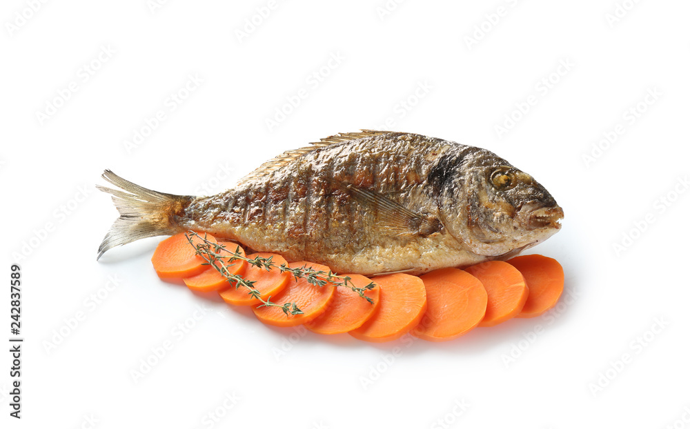 Grilled dorado fish with carrot on white background Grilled dorado fish with carrot on white background