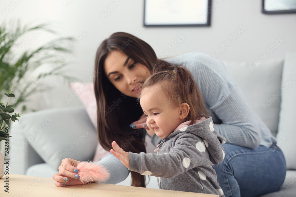 Cute baby girl with her mother at home Cute baby girl with her mother at home