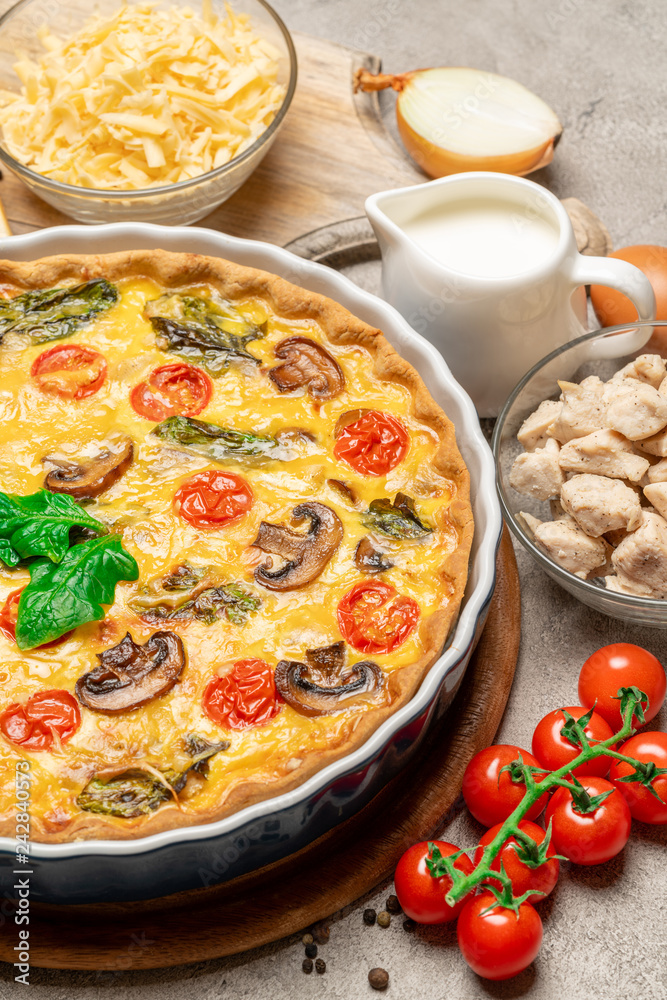 Baked homemade quiche pie in ceramic baking form, eggs and cream Baked homemade quiche pie in ceramic baking form, eggs and cream
