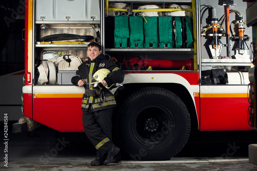Image of fireman man near fire truck
