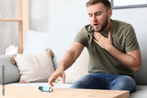 Young man with asthma attac...