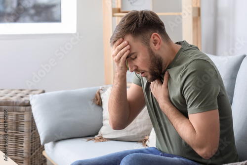 Young man having asthma att...