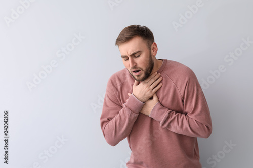 Young man having asthma att...