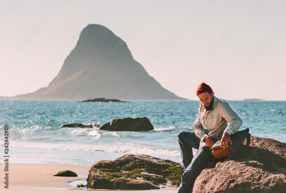 Man with backpack relaxing on beach sea summer trip vacations travel tourist lifestyle adventure journey outdoor in Norway
