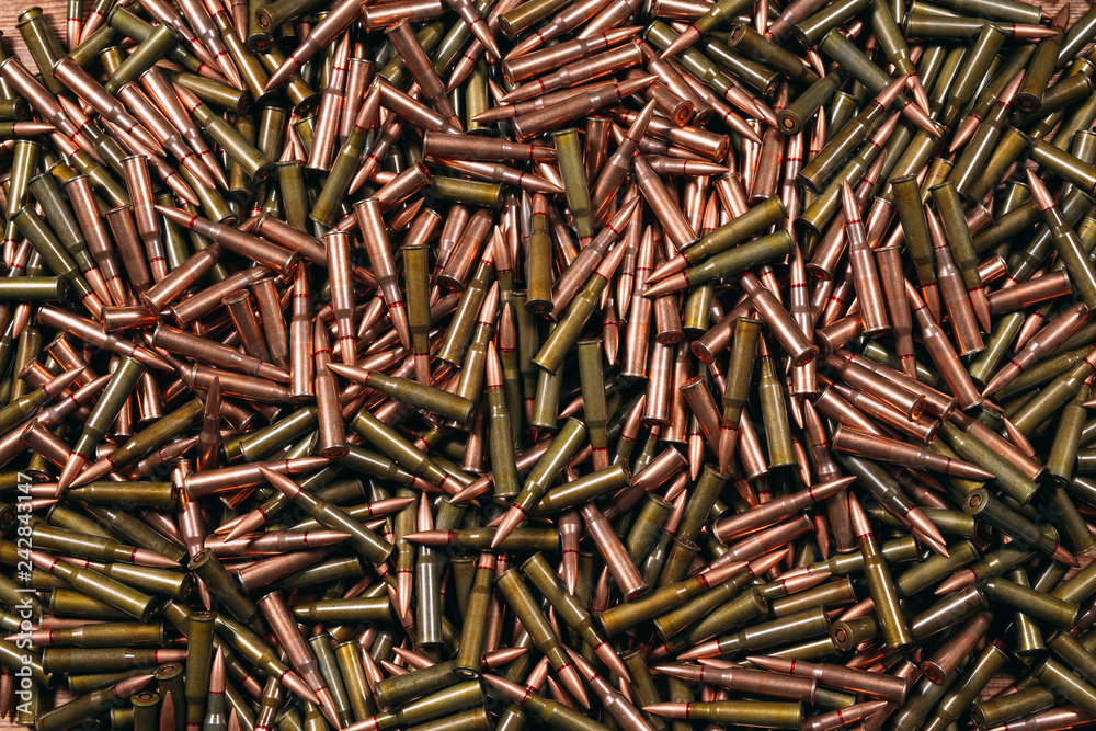 Different ammo on wooden background. Different ammo on wooden background.