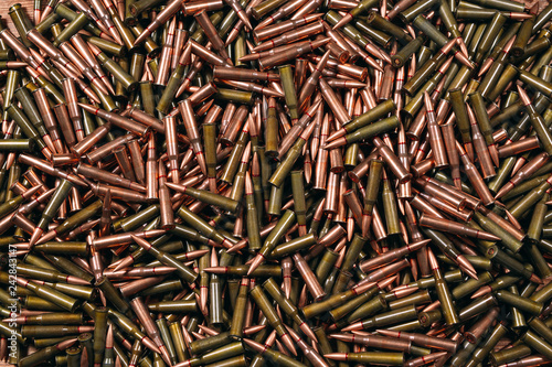 Different ammo on wooden background.