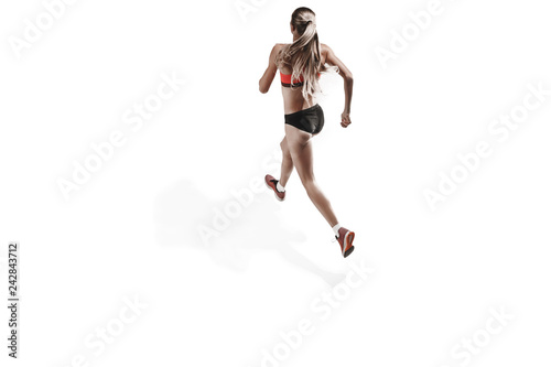 The one caucasian female silhouette of runner running and jumping on white studio background. The sprinter, jogger, exercise, workout, fitness, training, jogging concept. Back view © master1305