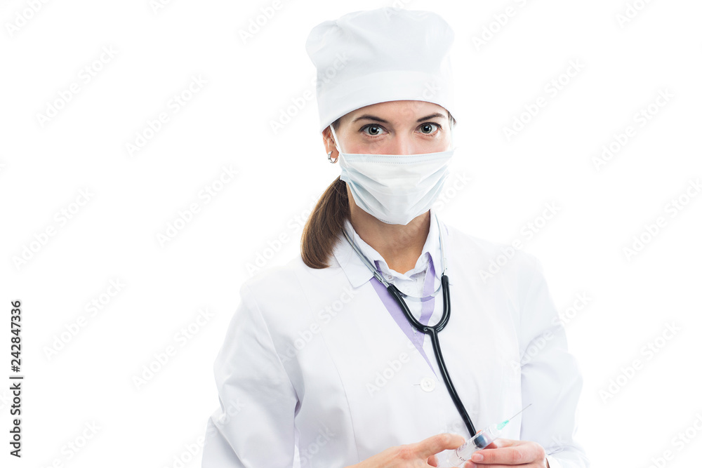 Doctor medical professional in white uniform holding a syringe in his hands on a white background and looking directly at the camera. Doctor medical professional in white uniform holding a syringe in his hands on a white background and looking directly at the camera.