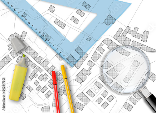 3D rendering of colored work tool over a cadastral map of territory with buildings, fields and roads - concept image