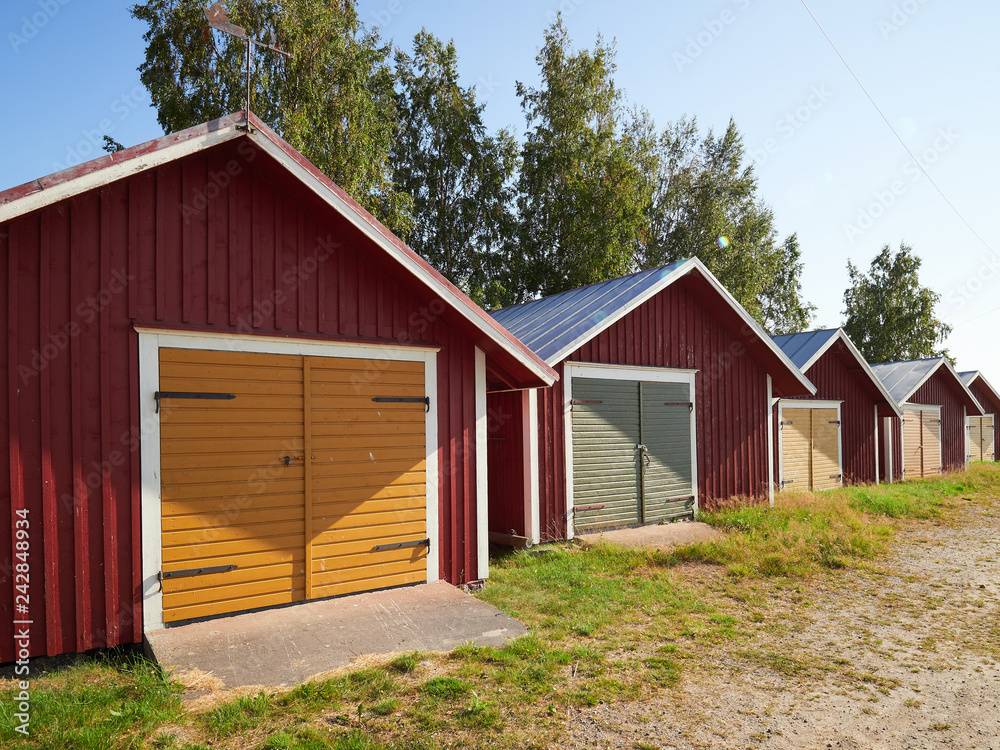 Beautiful small boathouses on warm summer day in Finland