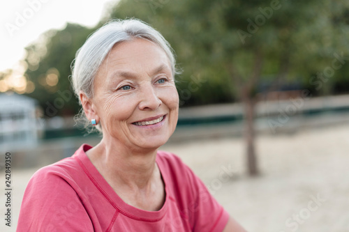 Portrait of relaxed senior woman outdoors