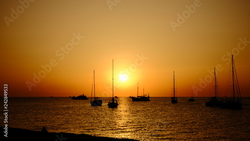 sunset at sea with yacht © tyunikov
