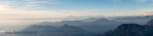 Panoramic view of the Italian Alps with fog on the Padana plain, Monte Rosa in the background. Viewpoint from the summit of Monte Resegone, Lombardy. Italian Landscape.