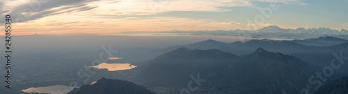 Panoramic view of the Italian Alps with fog on the Padana plain, Monte Rosa in the background. Viewpoint from the summit of Monte Resegone, Lombardy. Italian Landscape.