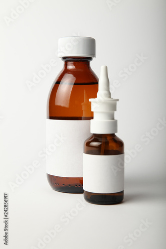 Medical glass bottle and spray mockup. Empty template isolated on white background.