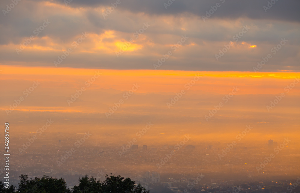 City view, orange light in the morning with fog