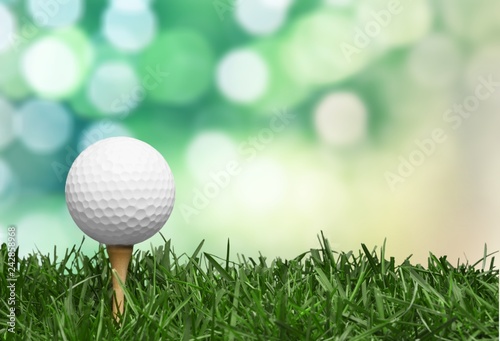 golf ball with a golf tee on